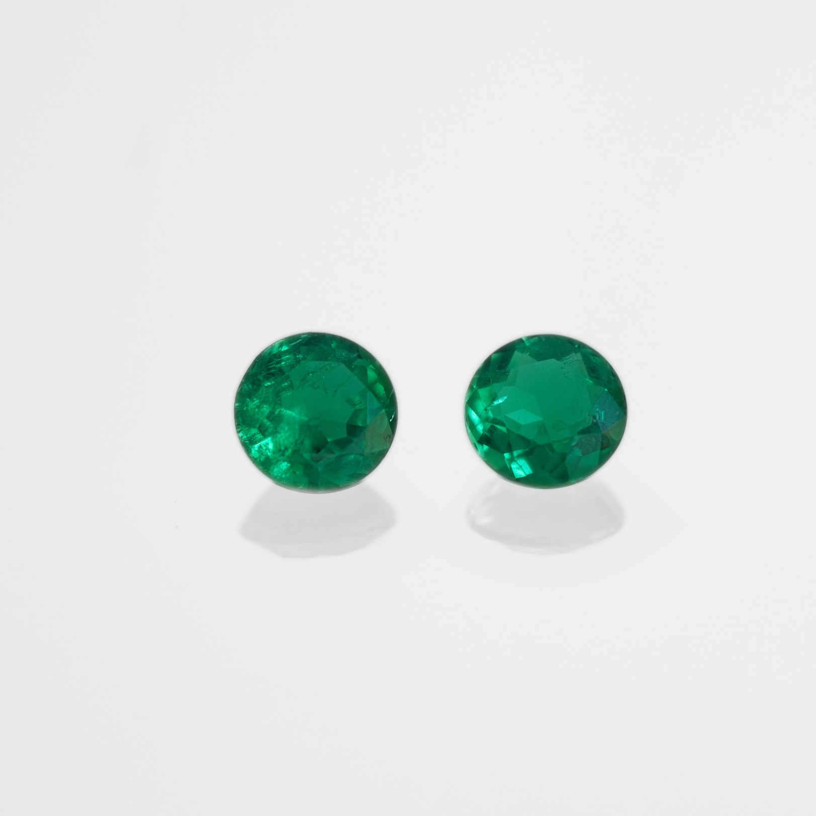 0,66 & 0,62 ct Muzo Round Cut